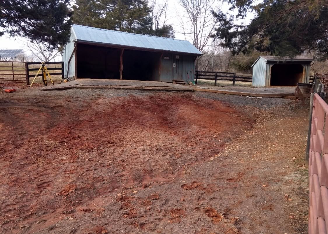 Before: horse barn with bare dirt lot