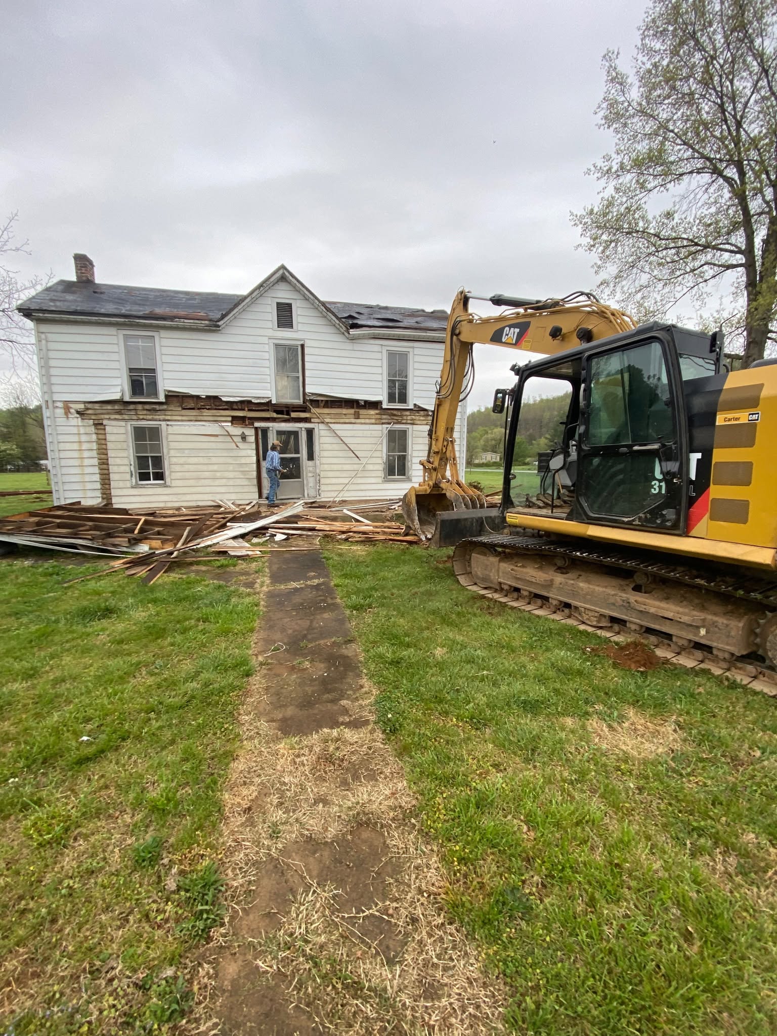 Before: old farmhouse mid-demolition