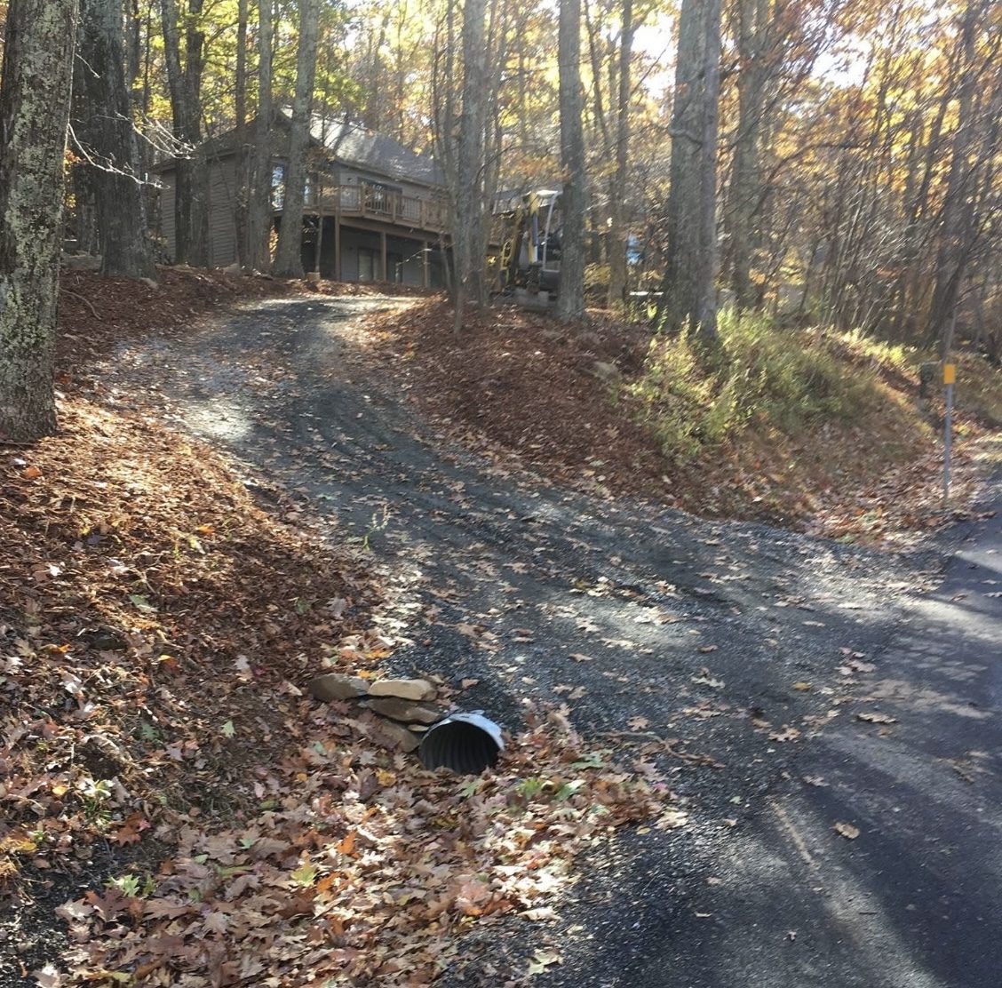 Finished gravel driveway leading up to house
